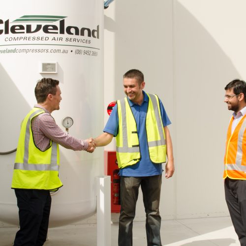 Businessmen buying an air receiver