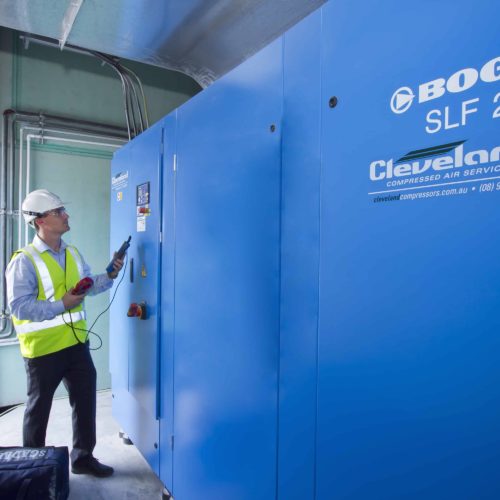 Experienced air compressor technician completing an audit.